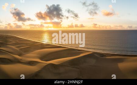 Landscape with golden sand dunes at sunrise in Maspalomas, Gran Canaria, Canary Islands, Spain Stock Photo