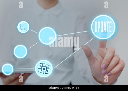 Text caption presenting UPDATE, Word for make something more modern or up to date like software program Lady Holding Tablet Pressing On Virtual Button Stock Photo