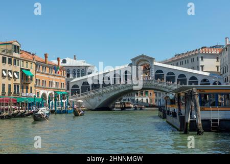 tourists enjoy the view from Rialto bridge to grand canal on a sunny day in the old quarter San Polo in Venice, Italy. Stock Photo