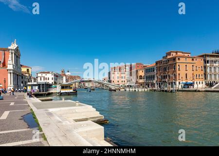 people crossing grand canal at ponte degli scalzi near luca railway station in Venice, Italy in quarter cannaregio Stock Photo