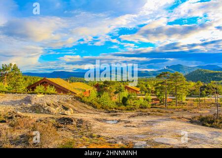 Norwegian wooden cabins cottages in the nature and mountain landscape of Treungen in Nissedal Norway. Stock Photo