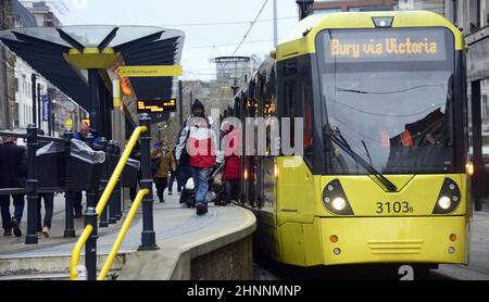 Metrolink Tram, with destination of Bury via Victoria Station, at Market Street tram stop, Manchester, England, UK Stock Photo