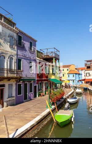 View of the colorful houses in Burano, Venice, Italy. Burano is an island in the Venetian Lagoon known for its lace work and brightly coloured homes Stock Photo
