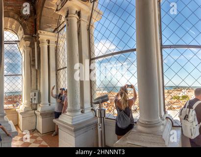 Venice, Italy - July 6, 2021: people enjoy the skyline from St. Mark's cathedral to skyline of Venice Stock Photo