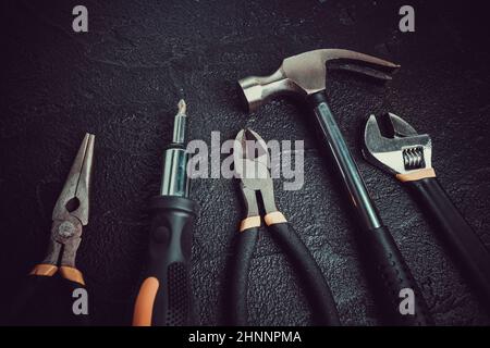 Many different tools for repair work on a black background Stock Photo