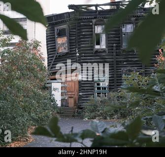 Old abandoned wooden house real street photo Stock Photo