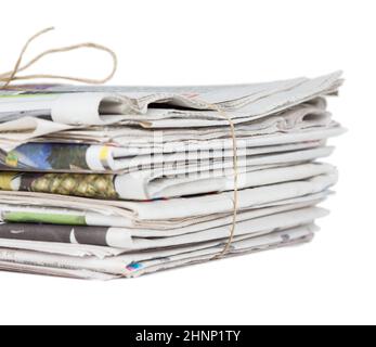 Pile of stacked generic folded newspapers background on white background with copy space. News and updates concept. Stock Photo