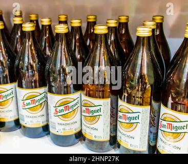 San Miguel beer bottles on shelf in supermarket Mallorca Spain. Stock Photo
