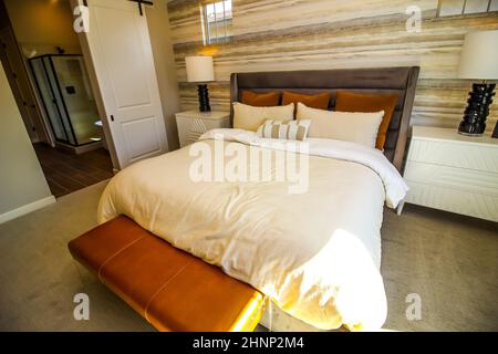 Master Bedroom With Foot Stool, Night Stands And Lamps Stock Photo