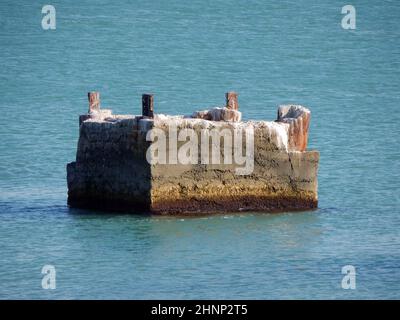 Ruined pier. Rusty pier support. Rusty destroyed pier support. Caspian Sea. Kazakhstan. Mangistau region. 08 October. 2019 year. Stock Photo