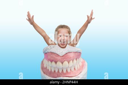Happy smiling girl with dentist tool Stock Photo