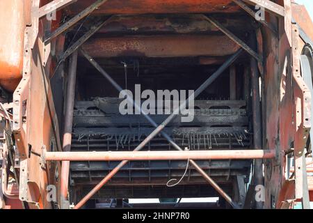 Old rusty disassembled combine harvester. Stock Photo