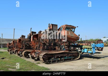 Old rusty disassembled combine harvester. Stock Photo