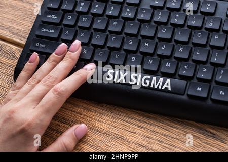 Inspiration showing sign Six Sigma. Conceptual photo set of management techniques intended to improve business process Hands Pointing Pressing Computer Keyboard Keys Typewriting New Ideas. Stock Photo