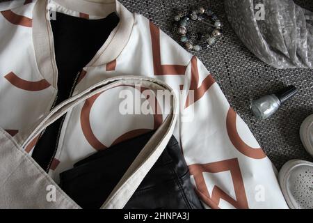 Autumn female outfit. Set of clothes, shoes and accessories on grey background Stock Photo