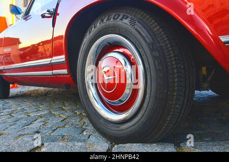 Mercedes Benz logo on vintage car wheel. Mercedes-Benz is a German automobile manufacturer. The brand is used for luxury automobiles, buses, coaches and trucks. Stock Photo
