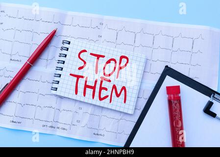 Text sign showing Stop Them. Word for used for telling someone not to do something that they are doing Reading Graph And Writing Important Medical Notes Test Result Analysis Stock Photo