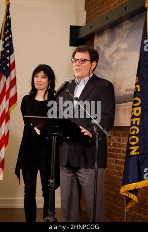 Portland, USA. 17th Feb, 2022. Nicholas Kristof, former New York Times reporter and columnist, and two-time Pulitzer prize winner, next to his wife Sheryl WuDunn, announces on February 17, 2022, in Portland, Oregon, the end of his bid for the governorship of Oregon, after his residency status was denied today by the Oregon Supreme Court. (Photo by John Rudoff/Sipa USA) Credit: Sipa USA/Alamy Live News Stock Photo