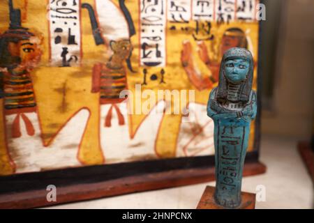 TURIN, ITALY - AUGUST 19, 2021: blue small figurine statuette during the Egyptian civilization, Egyptian Museum of Turin, Italy Stock Photo
