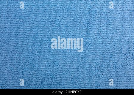 Microfiber Towel Blue Terry Texture Wrist Watch. Microfiber cloth with close-up. Fabric structure background. Fabric blue pattern. Cleaning service. M Stock Photo