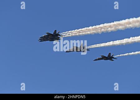 U S Navy Blue Angels Delta formation departs airspace over Point Loma following a fly-over of  USS Carl Vinson (CVN 70) Stock Photo