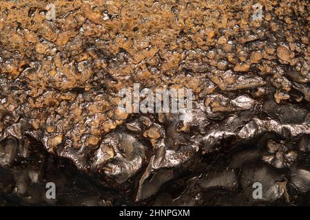 Meteorite texture background. meteorite surface close up. stone backdrop Stock Photo