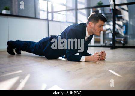 Man Doing Office Plank Exercise Workout Training Stock Photo
