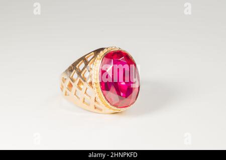 Golden ring with ruby isolated on white background Stock Photo