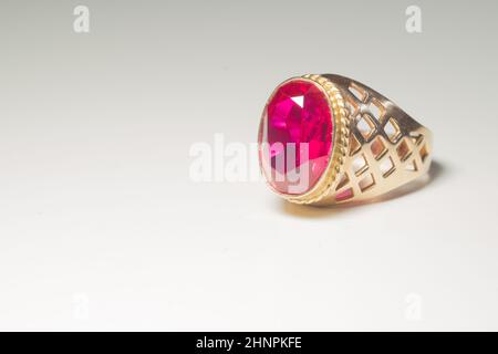 Golden ring with ruby isolated on white background Stock Photo