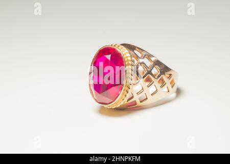 Golden ring with ruby isolated on white background Stock Photo