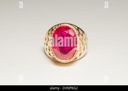 Golden ring with ruby isolated on white background Stock Photo