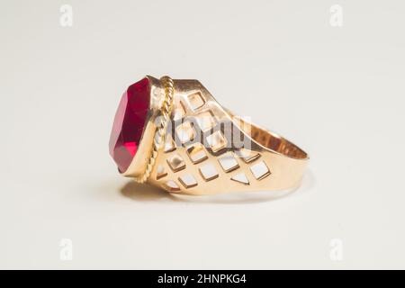 Golden ring with ruby isolated on white background Stock Photo