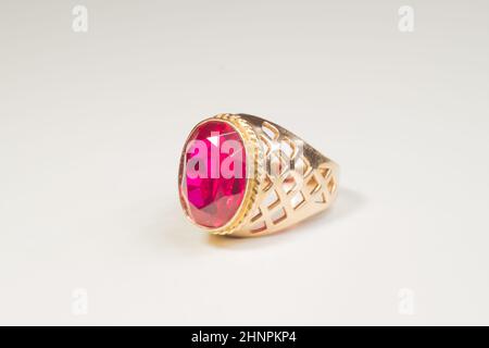 Golden ring with ruby isolated on white background Stock Photo