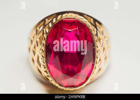 Golden ring with ruby isolated on white background Stock Photo