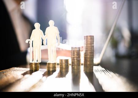 Elder Couple Saving And Managing Money For Retirement Stock Photo