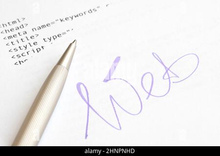 Website design concept with HTML script and ballpoint pen Stock Photo