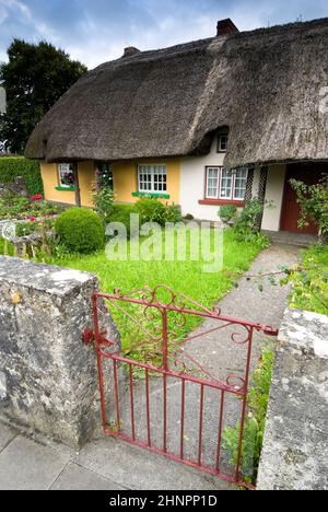 Heritage Cottage in a Town of Adare, Rep. of Ireland. Adare is regarded as being Ireland's prettiest and most picturesque village. Stock Photo