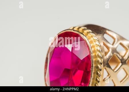 Golden ring with ruby isolated on white background Stock Photo