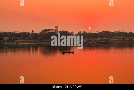Sunset photography on the river in winter 2022. This image was taken by me on January 17, 2022, from the Doleswori river, Bangladesh, South Asia. Stock Photo