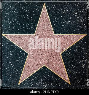 The empty star on the sidewalk of Hollywood Boulevard Walk of fames. Stock Photo