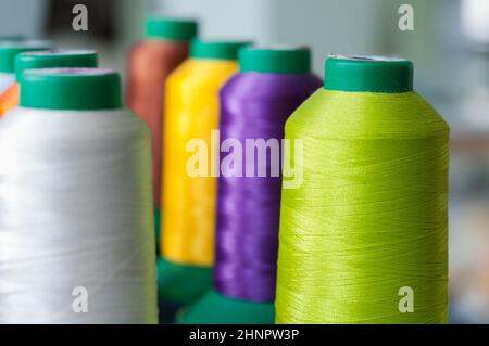 Sewing threads multicolored background closeup with shallow depth of field Stock Photo