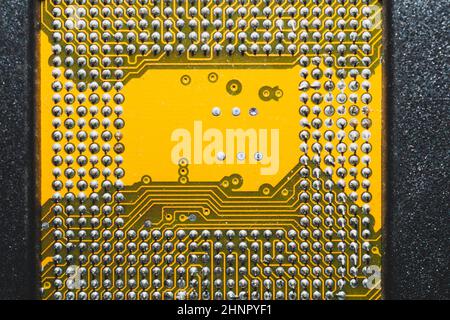 Processor pins macro. computer motherboard close up. cpu pins on a circuit board. micro elements of computer central processor unit. modern technologi Stock Photo