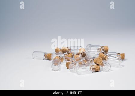 Empty little bottles with cork stopper isolated on white Stock Photo