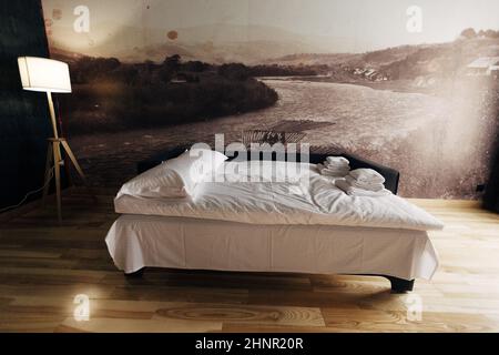 Hotel room. Wood finish. Beautiful interior with lamp Stock Photo