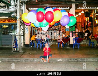 Man sells balloons in Khao San Road Stock Photo