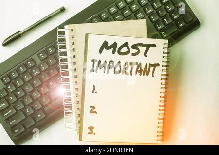 Hand writing sign Most Important, Business overview Greatest or highest degree quantity or the like Significant Two Plain Lined Spiral Notebooks With Stock Photo