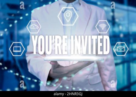 Writing displaying text You Re Invited, Business idea make a polite friendly request to someone go somewhere Lady Uniform Standing Tablet Hand Present Stock Photo