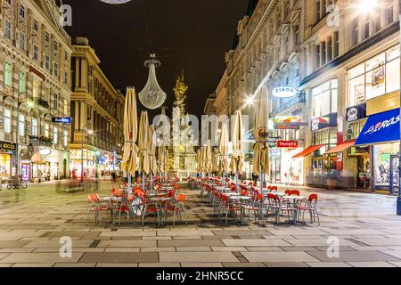 famous Graben street at night with rain reflection on the cobbles Stock Photo