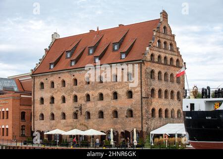 A restored medieval granary on the Olowianka island in the old town of Gdansk Stock Photo