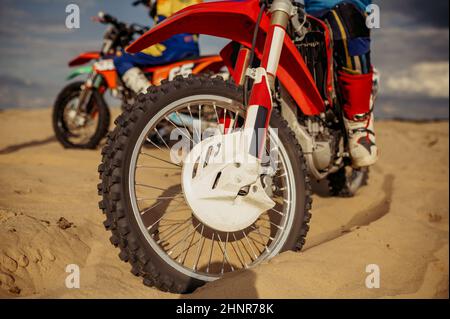 Motocross rider on extreme desert terrain track Stock Photo